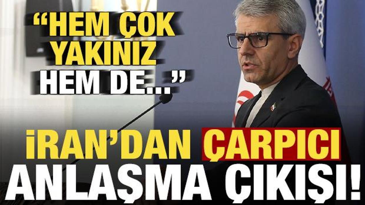 İran ve ABD arasındaki diplomatik görüşmeleri temsil eden toplantı masası ve ülke bayrakları